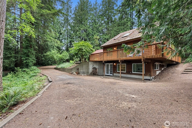 13600 Hillcrest St NW, Poulsbo, WA 98370 - back of property with a deck, a patio, and driveway