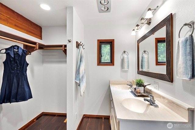 13600 Hillcrest St NW, Poulsbo, WA 98370 - full bathroom with wood finished floors and double vanity