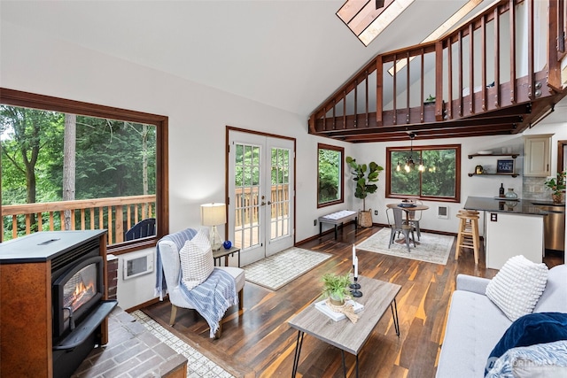 13600 Hillcrest St NW, Poulsbo, WA 98370 - living area featuring a wood stove, high vaulted ceiling, wood finished floors, and french doors