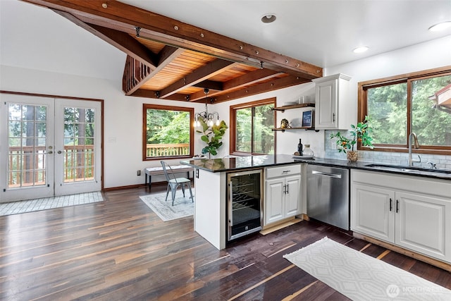 13600 Hillcrest St NW, Poulsbo, WA 98370 - kitchen featuring stainless steel dishwasher, beverage cooler, beamed ceiling, white cabinets, and a peninsula