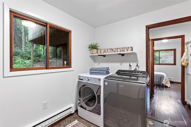 13600 Hillcrest St NW, Poulsbo, WA 98370 - laundry area featuring a baseboard heating unit, separate washer and dryer, and dark wood finished floors
