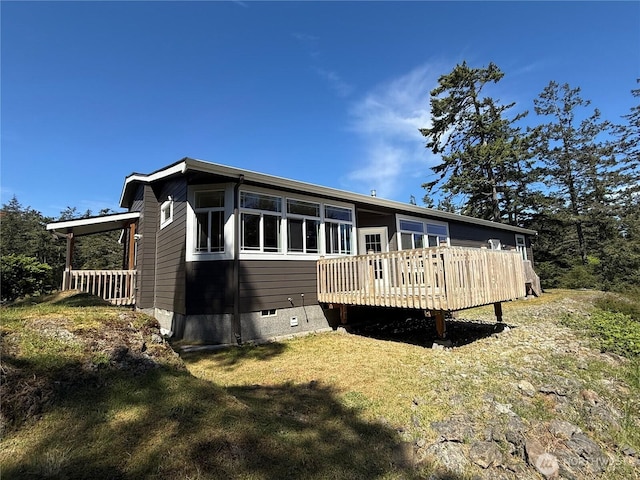 168 Jackson Rd, Orcas Island, WA 98245 - back of property featuring a deck, crawl space, and a lawn