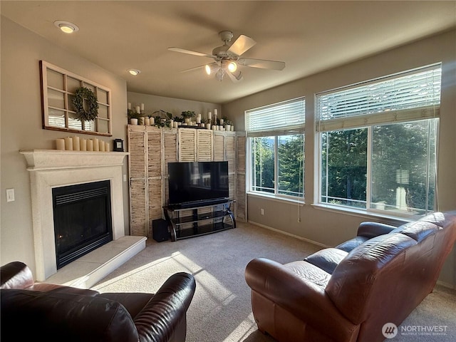168 Jackson Rd, Orcas Island, WA 98245 - living area with carpet, a ceiling fan, a glass covered fireplace, and baseboards