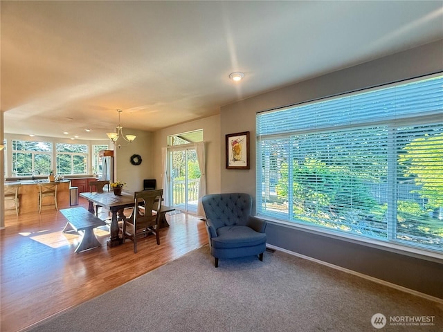168 Jackson Rd, Orcas Island, WA 98245 - dining area featuring baseboards, a chandelier, wood finished floors, and recessed lighting