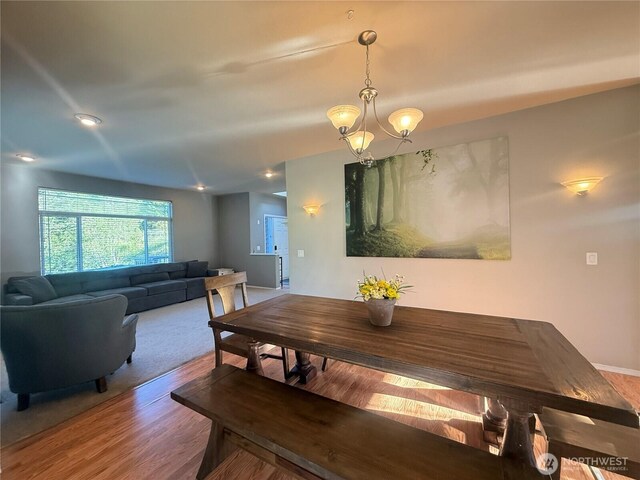 168 Jackson Rd, Orcas Island, WA 98245 - dining space featuring wood finished floors, baseboards, and a chandelier
