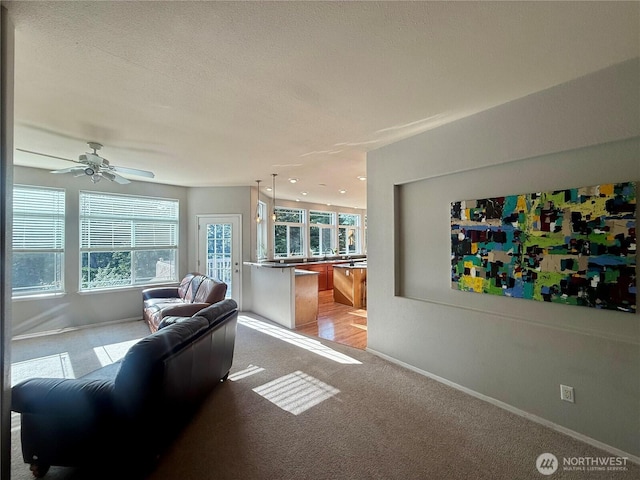 168 Jackson Rd, Orcas Island, WA 98245 - living room with light carpet, baseboards, and ceiling fan