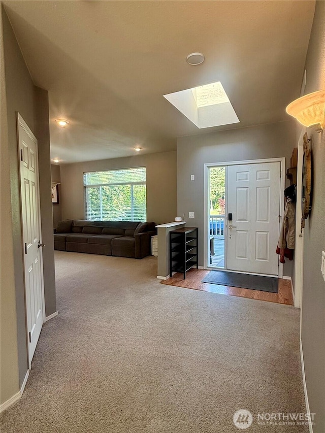 168 Jackson Rd, Orcas Island, WA 98245 - carpeted entrance foyer featuring a skylight, baseboards, and recessed lighting