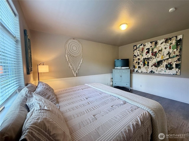 168 Jackson Rd, Orcas Island, WA 98245 - bedroom featuring wainscoting and wood finished floors