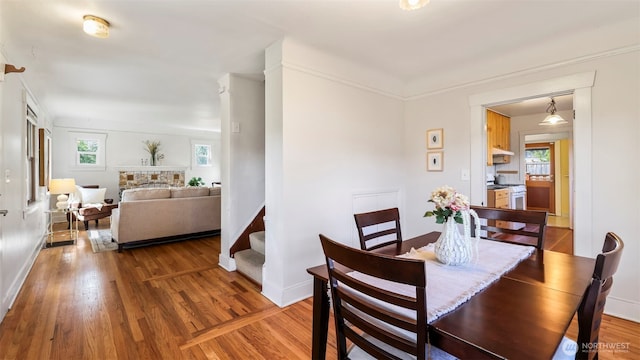 dining area featuring wood finished floors and baseboards