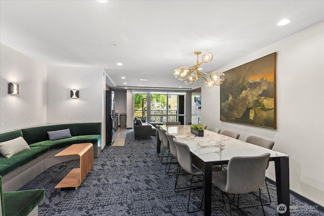 76 Cedar St Unit Ph07, Seattle, WA 98121 - dining area featuring dark colored carpet, a chandelier, and recessed lighting