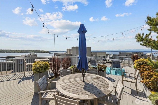 76 Cedar St Unit Ph07, Seattle, WA 98121 - wooden deck with outdoor dining space and a water view