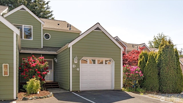 garage with aphalt driveway