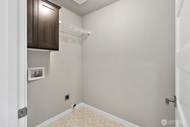 laundry area with hookup for a washing machine, hookup for an electric dryer, cabinet space, and baseboards