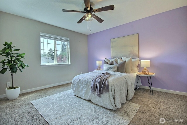 carpeted bedroom featuring baseboards and ceiling fan
