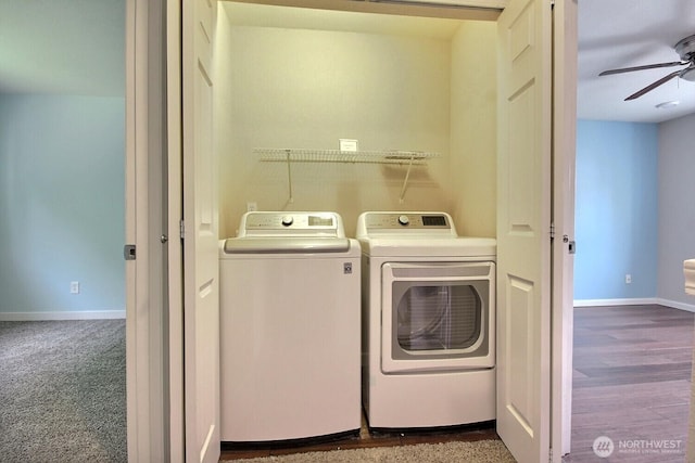 laundry area featuring a ceiling fan, baseboards, laundry area, and washer and clothes dryer