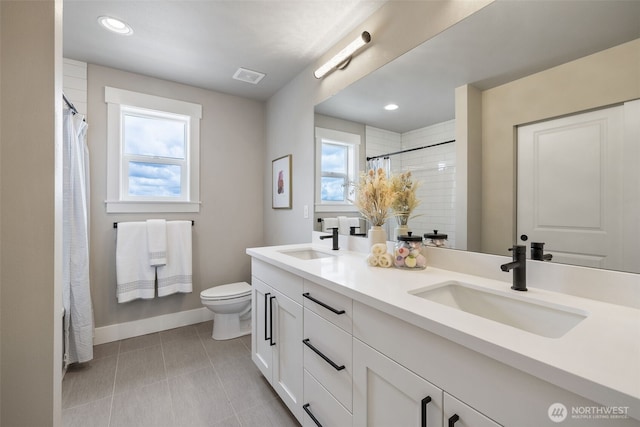 20018 7th Ave SE, Bothell, WA 98012 - bathroom with toilet, baseboards, visible vents, and a sink