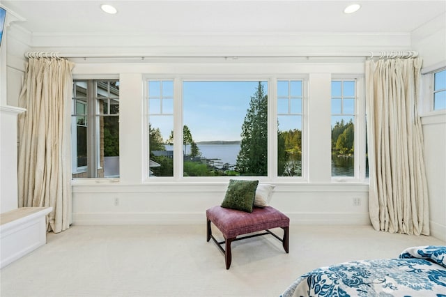 sunroom / solarium with a water view