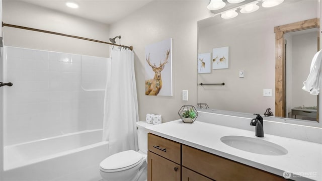 bathroom featuring vanity, toilet, and shower / tub combo