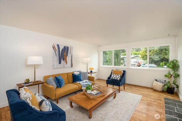 living area featuring wood finished floors and baseboards