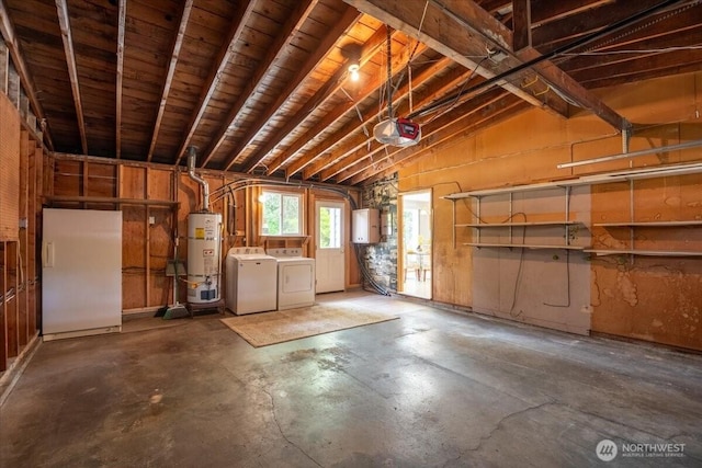 garage featuring independent washer and dryer, freestanding refrigerator, secured water heater, a garage door opener, and electric panel
