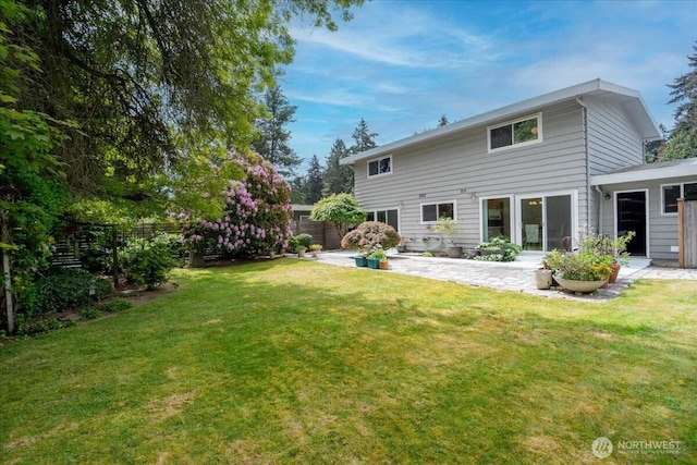 back of house with a patio