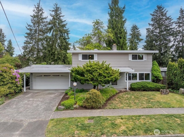 traditional home featuring an attached garage, a front lawn, driveway, and a chimney