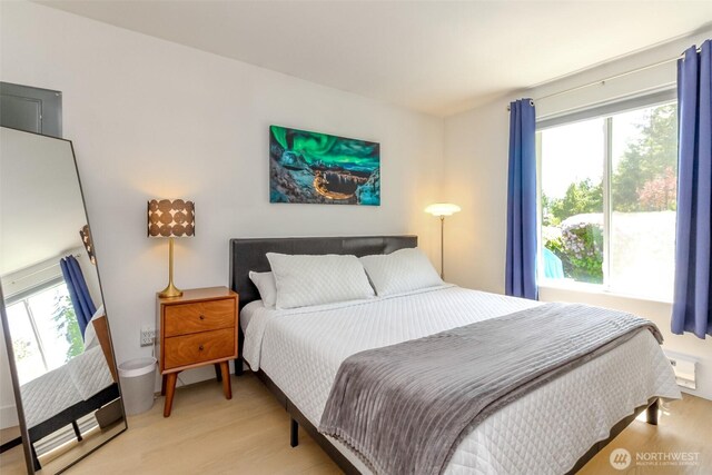 bedroom featuring light wood finished floors