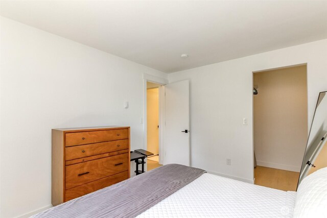 bedroom featuring baseboards