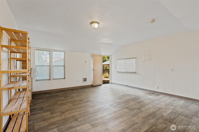 406 S Chestnut St, Ellensburg, WA 98926 - unfurnished room with vaulted ceiling, wood finished floors, and baseboards