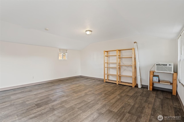 406 S Chestnut St, Ellensburg, WA 98926 - unfurnished room with vaulted ceiling, dark wood-type flooring, a wall mounted AC, and baseboards