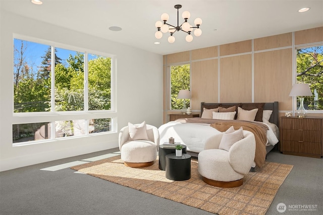 carpeted bedroom featuring a chandelier and recessed lighting