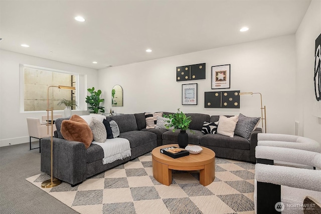 living room featuring recessed lighting and light carpet