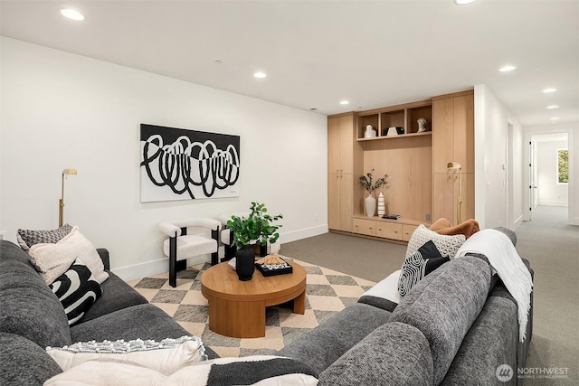 living area featuring recessed lighting, baseboards, and carpet floors