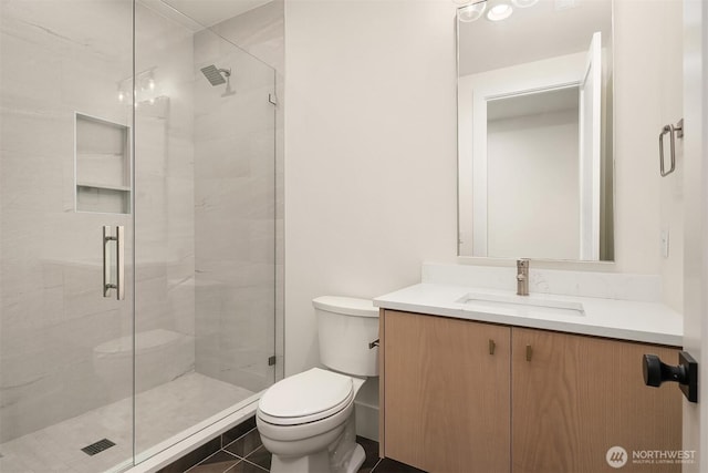 full bathroom with toilet, a shower stall, vanity, and tile patterned flooring