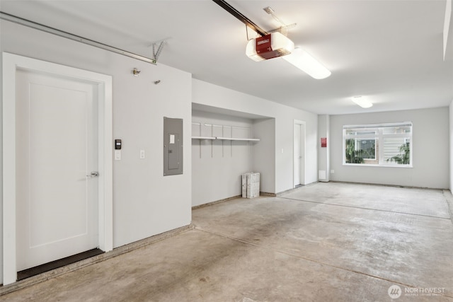 garage featuring a garage door opener and electric panel