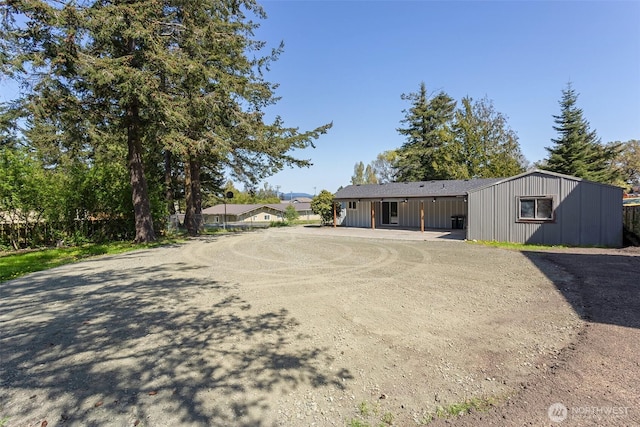single story home featuring board and batten siding