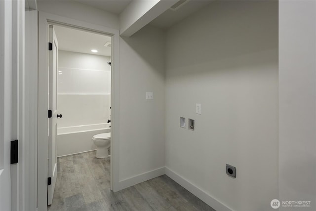 interior space with visible vents, wood finished floors, baseboards, toilet, and recessed lighting
