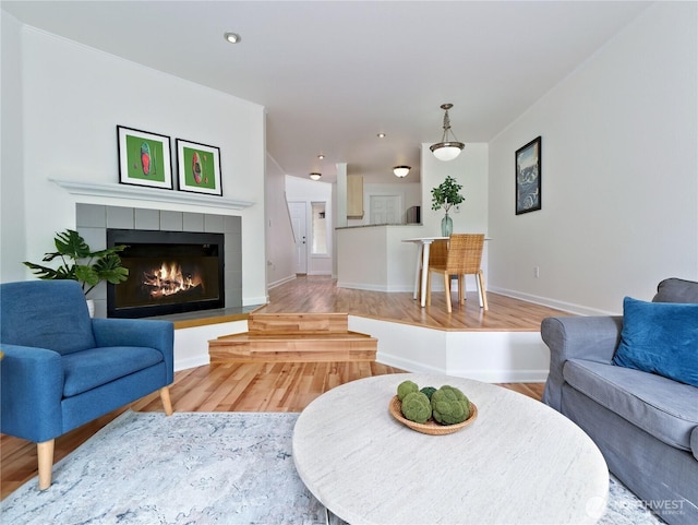 4350 W Lake Sammamish Pkwy SE Unit 133, Issaquah, WA 98027 - living room with wood finished floors, a tile fireplace, baseboards, and recessed lighting
