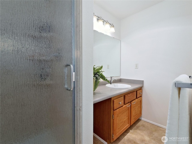 4350 W Lake Sammamish Pkwy SE Unit 133, Issaquah, WA 98027 - full bathroom with vanity, a stall shower, tile patterned flooring, and baseboards