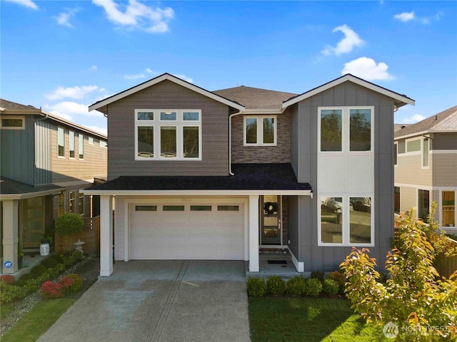 view of front of property featuring a garage, a shingled roof, board and batten siding, and driveway