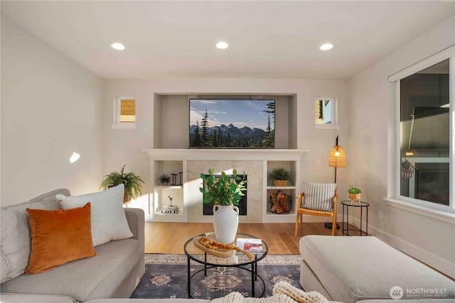 living room with recessed lighting and wood finished floors