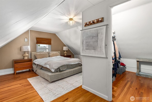 707 N 10th St, Tacoma, WA 98403 - bedroom with vaulted ceiling, wood finished floors, and baseboards