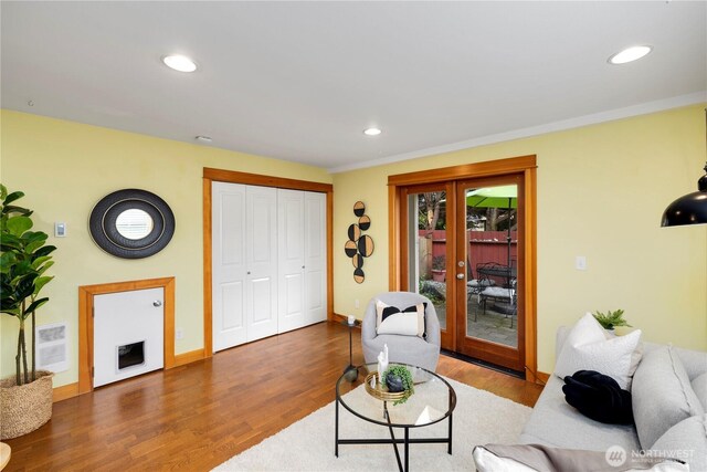 living area with french doors, recessed lighting, baseboards, and wood finished floors