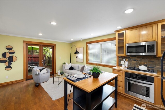 kitchen with recessed lighting, dark wood finished floors, backsplash, and stainless steel appliances