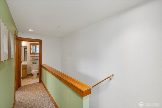 hall with baseboards, light carpet, recessed lighting, and an upstairs landing