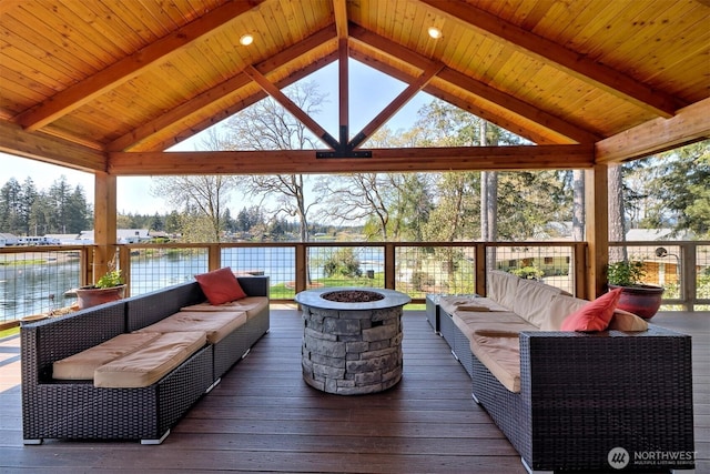 wooden terrace with a gazebo, an outdoor living space with a fire pit, and a water view