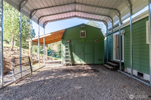 view of shed with a detached carport and entry steps