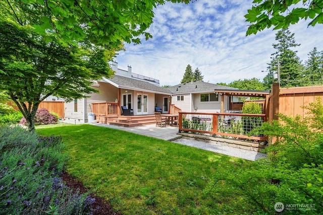 5015 SW Prince St, Seattle, WA 98116 - back of property with a wooden deck and a patio area