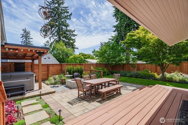 5015 SW Prince St, Seattle, WA 98116 - deck featuring a hot tub, outdoor dining area, a fenced backyard, and a patio
