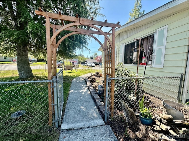 exterior space with a gate and fence